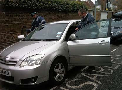 Civil Enforcement Officers issue parking icket to disabled driver after parking in her disabled bay